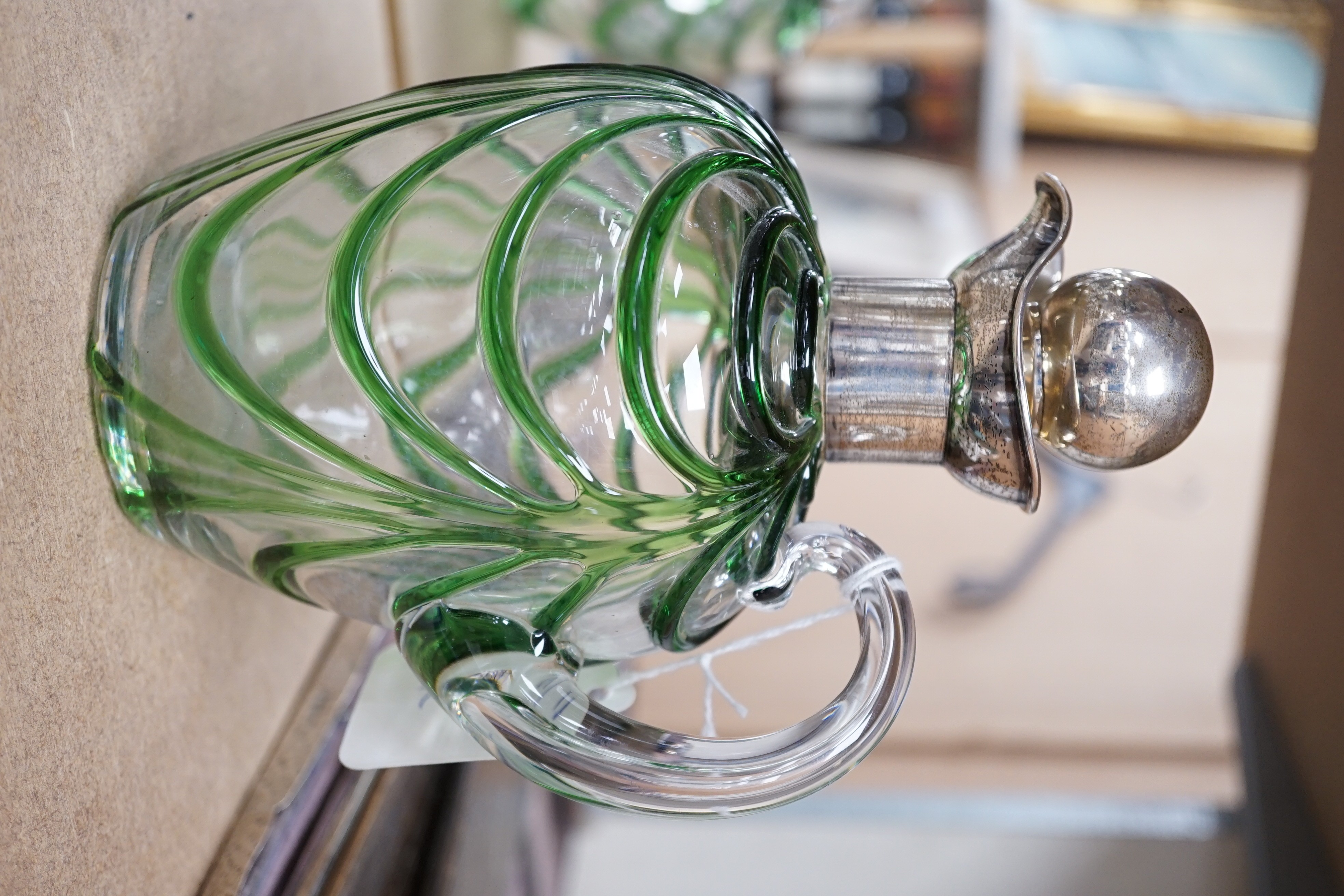 A late Victorian Art Nouveau silver mounted glass claret jug and stopper, D & M Davis, Birmingham, 1900, the glass with ribbed green swags, height 20.7cm.